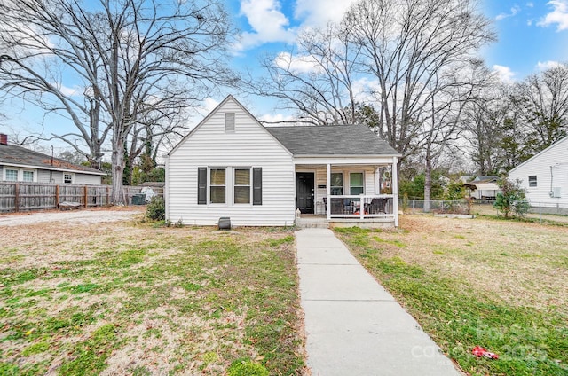 bungalow-style house with a porch and a front yard