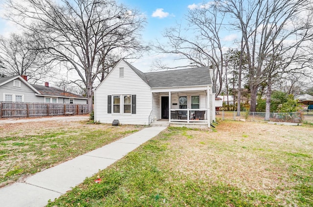 bungalow-style house featuring a front lawn and a porch