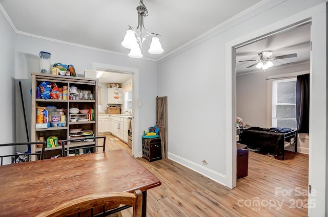 office area with sink, light wood-type flooring, ceiling fan with notable chandelier, and ornamental molding