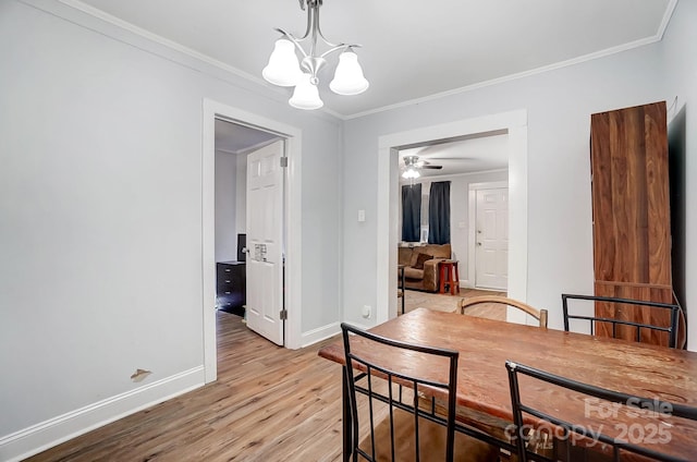 dining space featuring ceiling fan with notable chandelier, light wood-type flooring, and ornamental molding