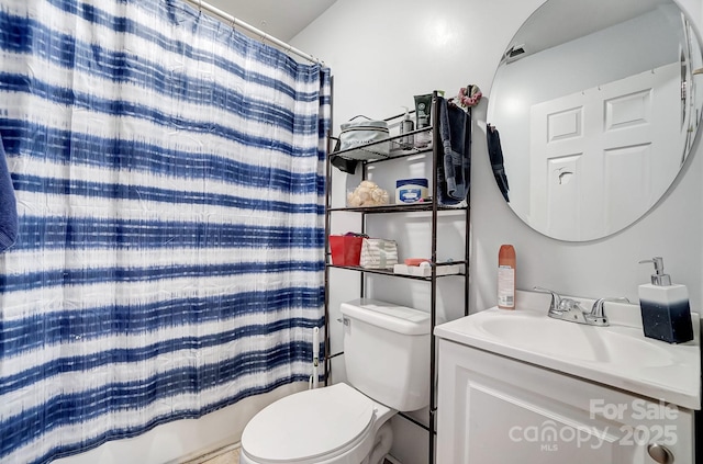 bathroom featuring a shower with curtain, vanity, and toilet