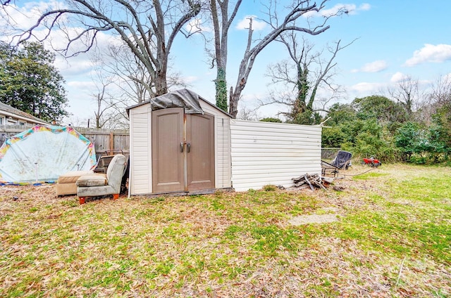 view of outbuilding featuring a yard