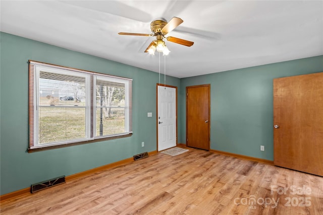 unfurnished room featuring ceiling fan and light hardwood / wood-style flooring