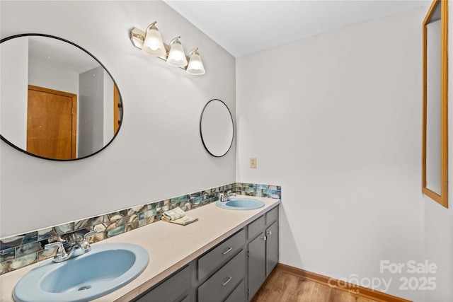 bathroom featuring hardwood / wood-style floors and vanity