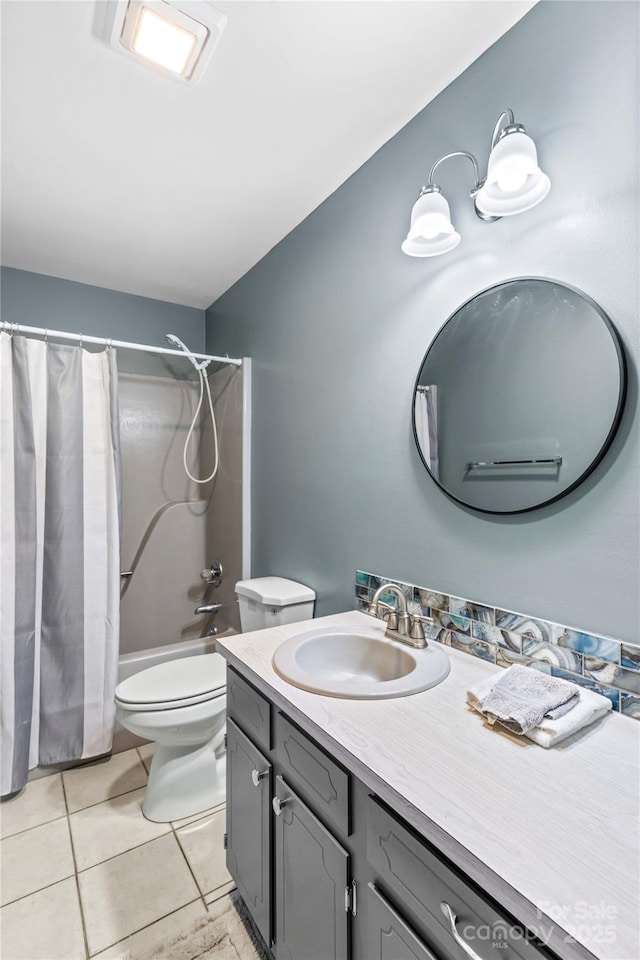 full bathroom featuring tile patterned flooring, vanity, shower / bath combination with curtain, and toilet