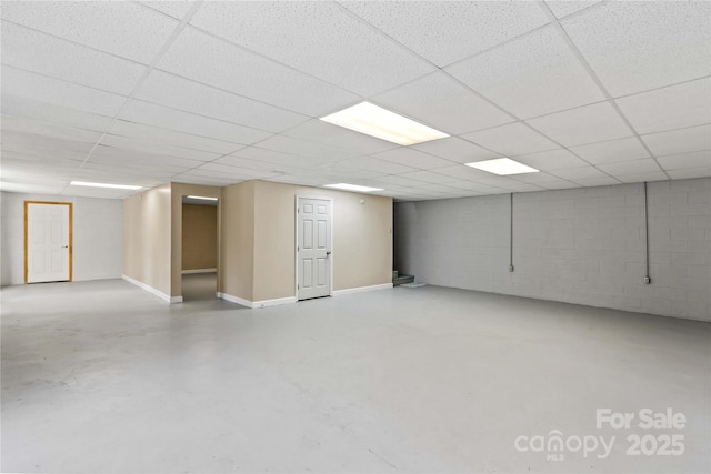 basement featuring a paneled ceiling