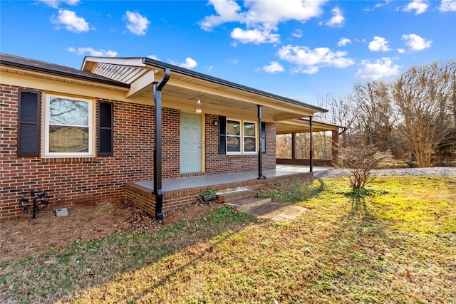 view of property exterior featuring a porch and a yard