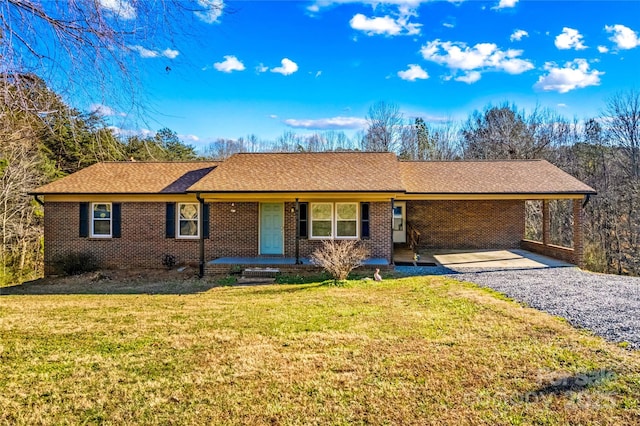 ranch-style home with a carport and a front yard