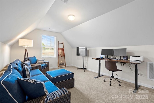 office space with light carpet and lofted ceiling