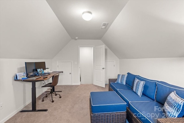 home office with carpet floors and lofted ceiling