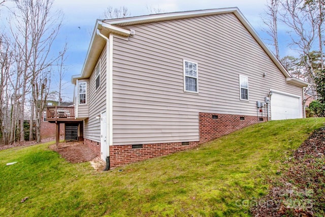 view of side of property featuring a garage, a lawn, and a deck