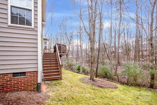 view of yard with a wooden deck