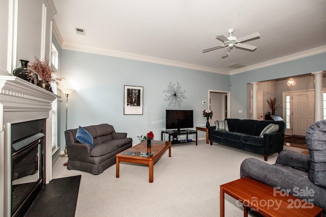 living room with ornamental molding, carpet floors, decorative columns, and ceiling fan