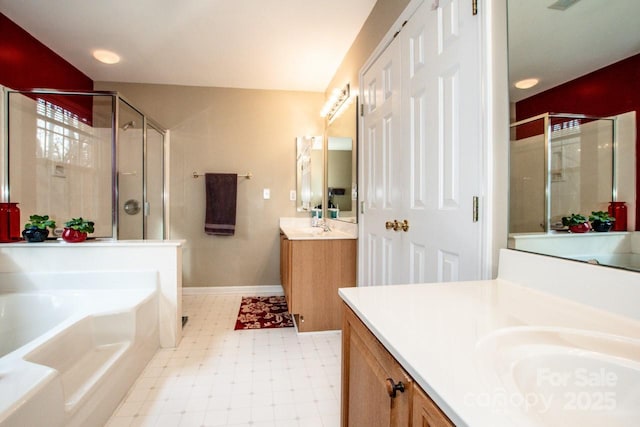 bathroom with vanity and separate shower and tub