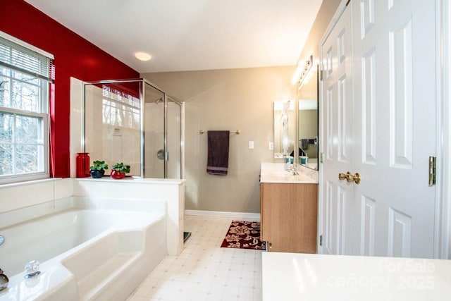 bathroom featuring vanity and shower with separate bathtub