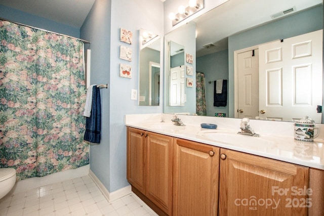 bathroom with vanity and toilet