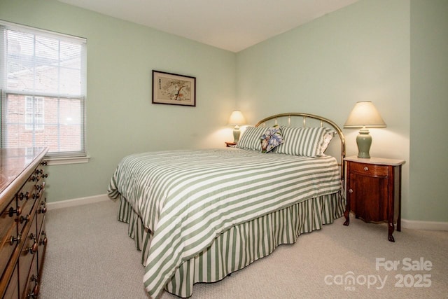 carpeted bedroom with multiple windows