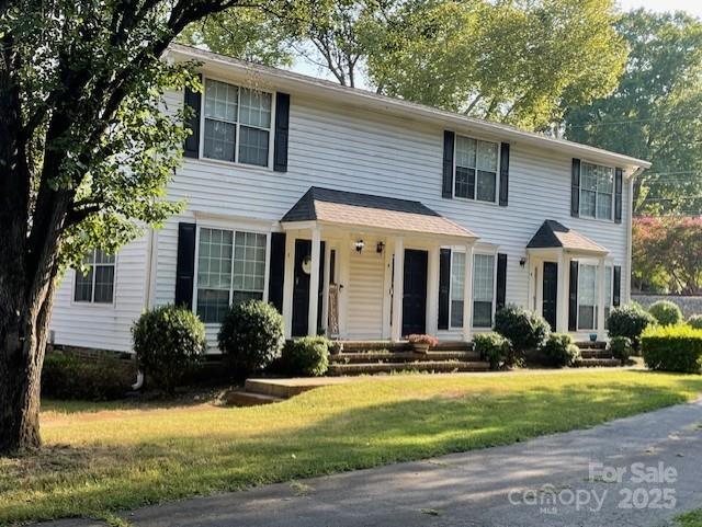 colonial home with a front yard