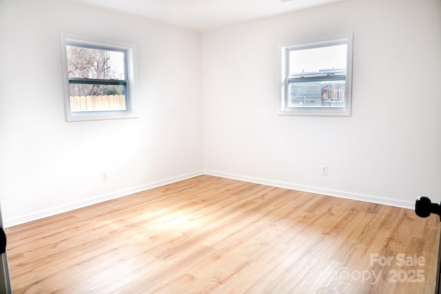 spare room with light wood-type flooring