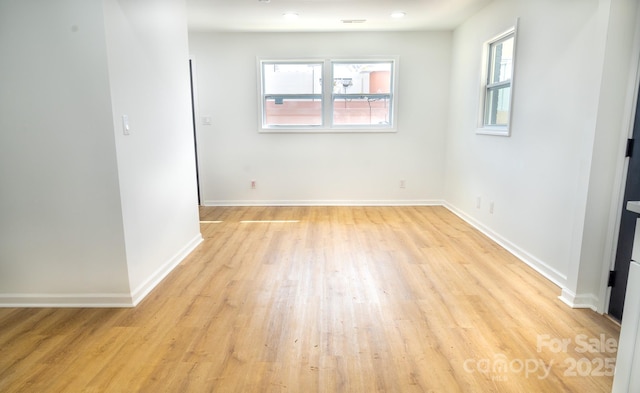 empty room with light wood-type flooring