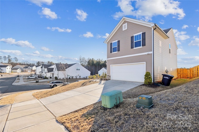 view of property exterior with a garage