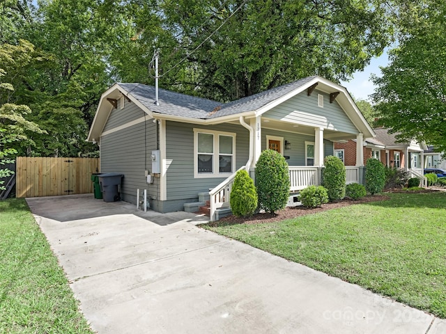 view of front facade with a front lawn and a porch