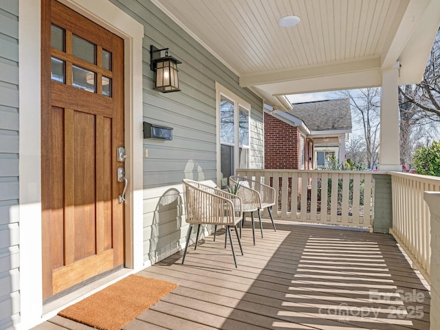 wooden deck featuring covered porch