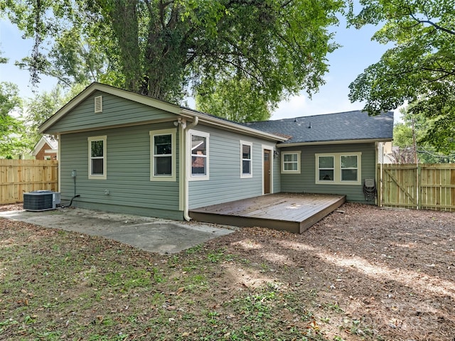 rear view of house featuring a deck, central AC, and a patio