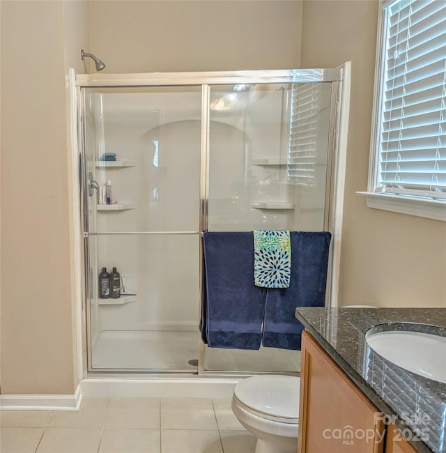 bathroom featuring tile patterned floors and an enclosed shower