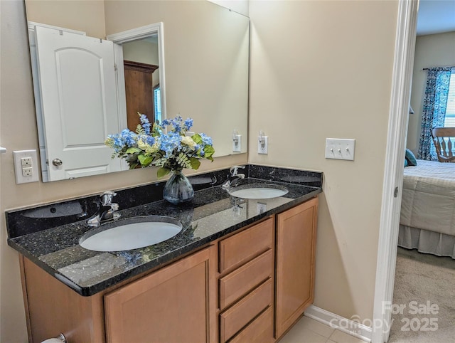 bathroom with tile patterned flooring and vanity