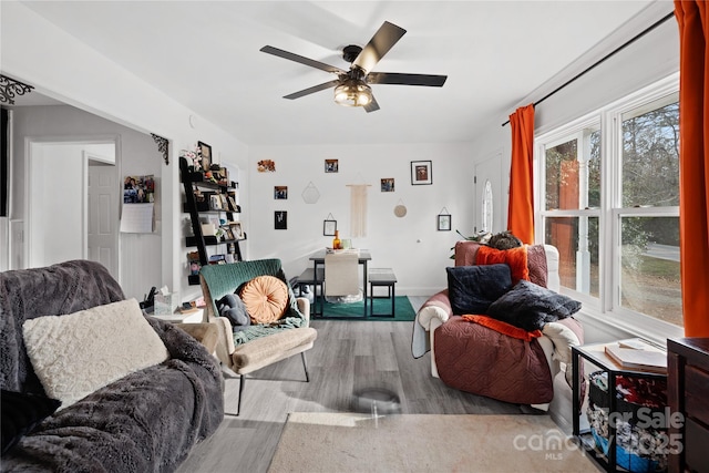 living room with ceiling fan and light hardwood / wood-style floors