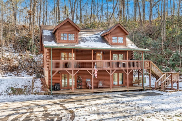 log-style house with a deck