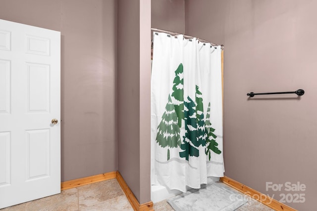 bathroom featuring a shower with curtain