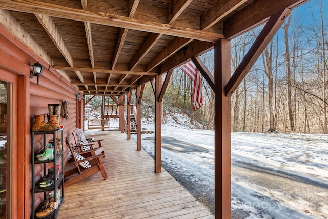 snow covered deck with stairs