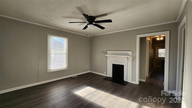 unfurnished living room featuring ceiling fan, crown molding, dark hardwood / wood-style floors, and a textured ceiling