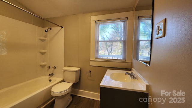 full bathroom with shower / tub combination, vanity, toilet, and hardwood / wood-style floors