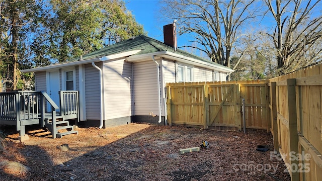 view of side of property with a deck