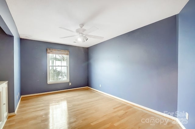 unfurnished room with ceiling fan and light wood-type flooring