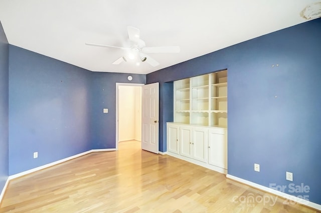 unfurnished room featuring ceiling fan and light hardwood / wood-style floors