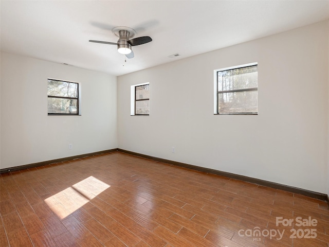 unfurnished room featuring ceiling fan and hardwood / wood-style flooring