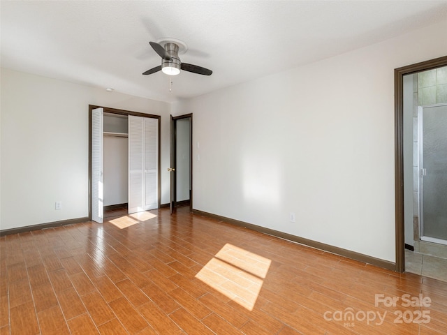 unfurnished bedroom featuring a closet and ceiling fan