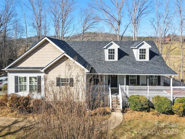 new england style home with covered porch