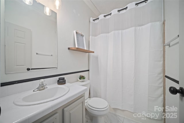 full bath featuring toilet, marble finish floor, and vanity