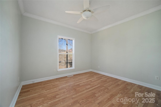 empty room featuring light wood-style floors, crown molding, baseboards, and ceiling fan