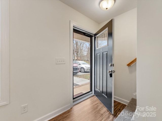 foyer entrance with hardwood / wood-style flooring