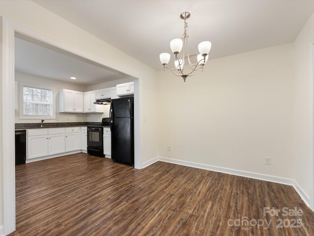 kitchen with hanging light fixtures, dark hardwood / wood-style floors, a chandelier, white cabinets, and black appliances