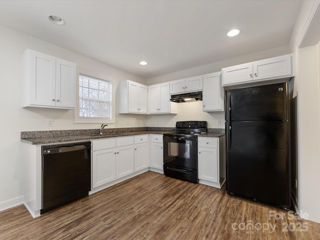 kitchen featuring dark hardwood / wood-style flooring, sink, white cabinets, and black appliances