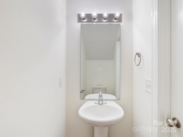 bathroom with sink and toilet