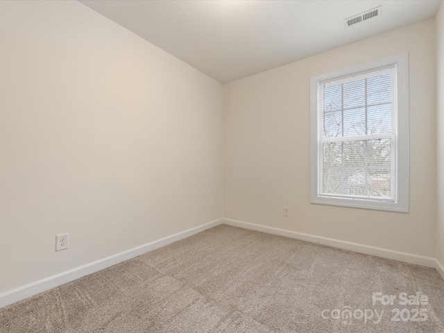 unfurnished room with carpet flooring