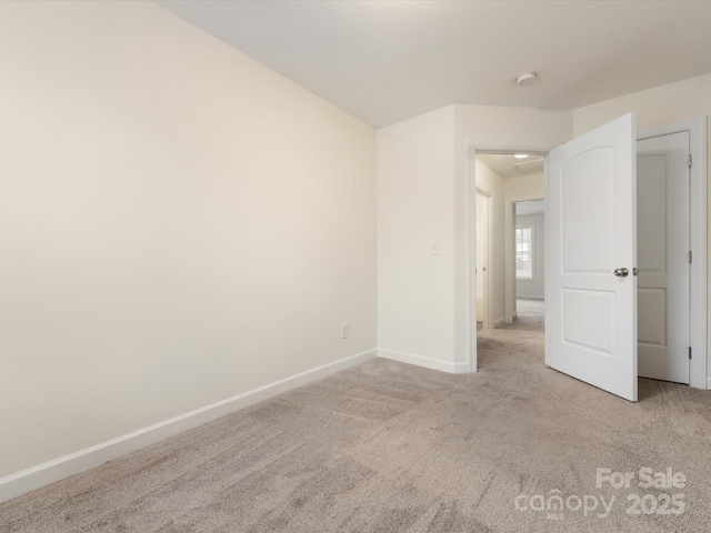 empty room with light colored carpet